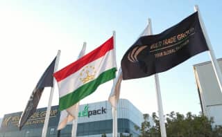 Illustrative Tajikistan flag with Multi Trade Group branding